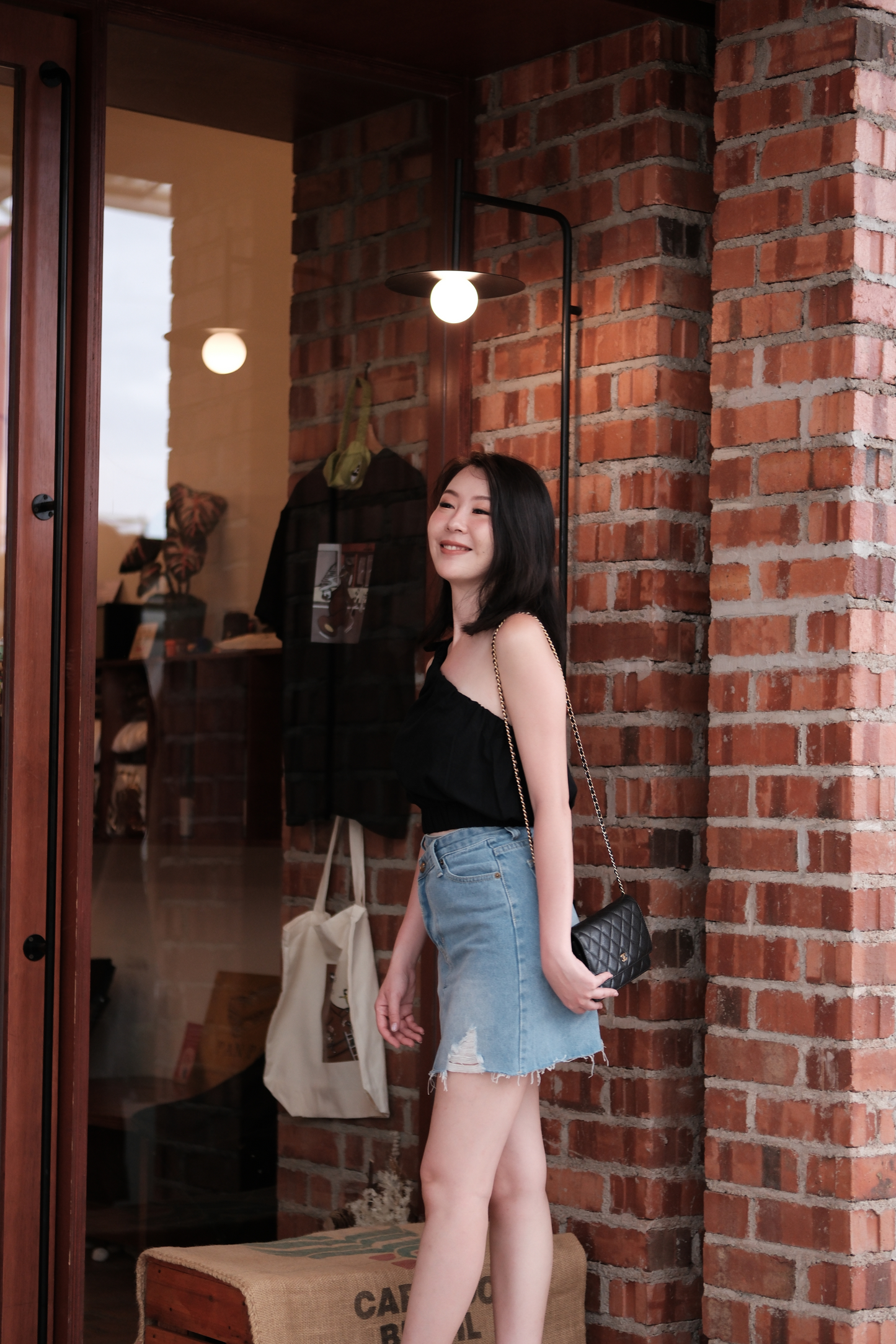 Sasha One-Shoulder Bow Crop Top in Black
