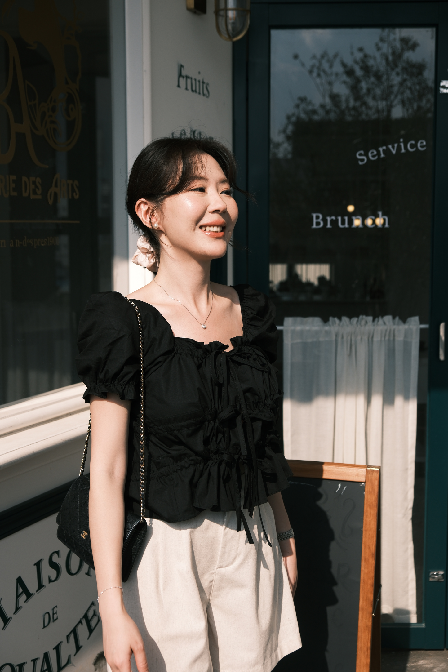 Noelle Ruched Tie Blouse in Black