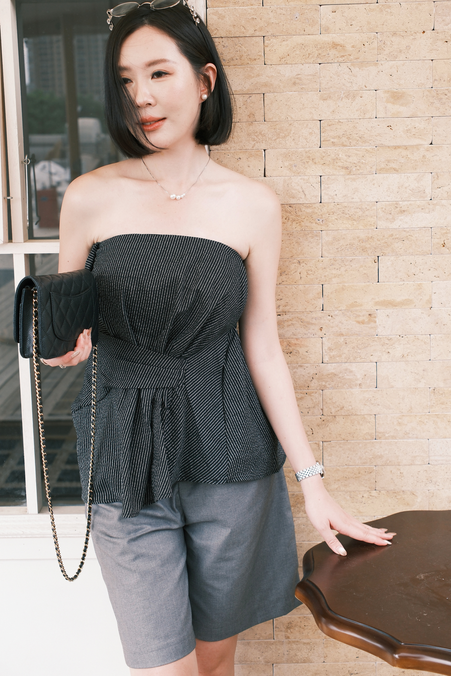Éloise Strapless Pinstripe Peplum Top in Black