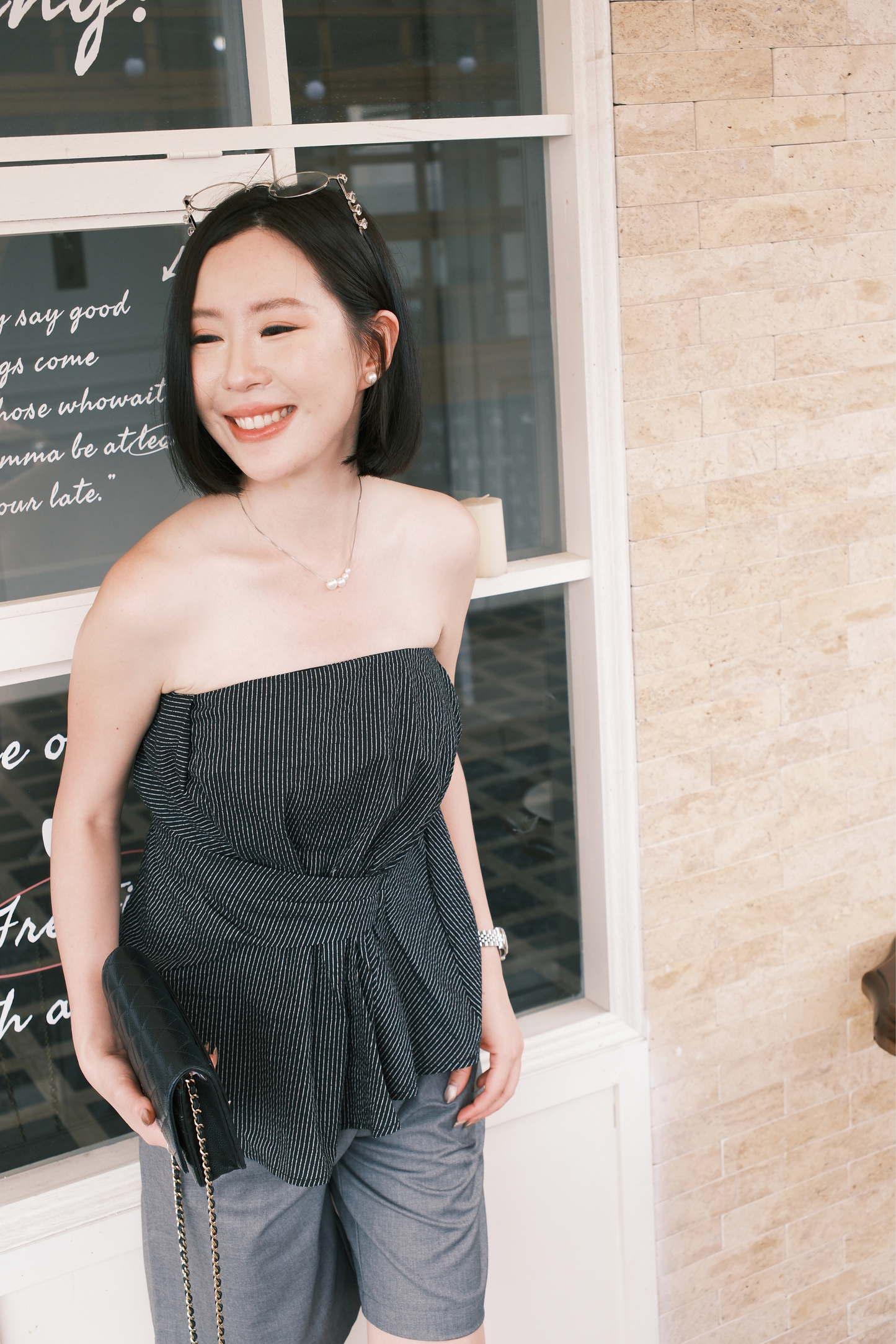 Éloise Strapless Pinstripe Peplum Top in Black