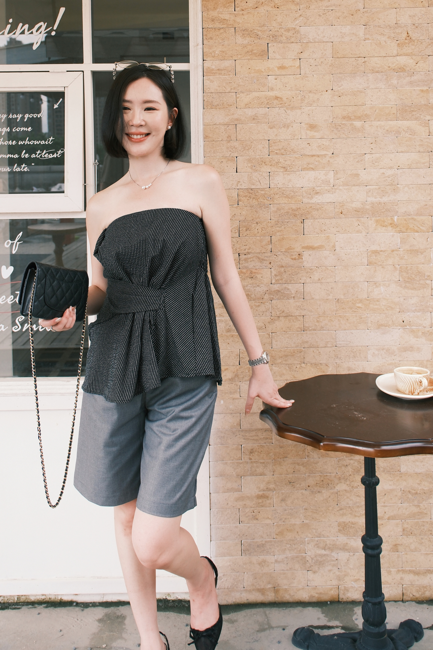 Éloise Strapless Pinstripe Peplum Top in Black