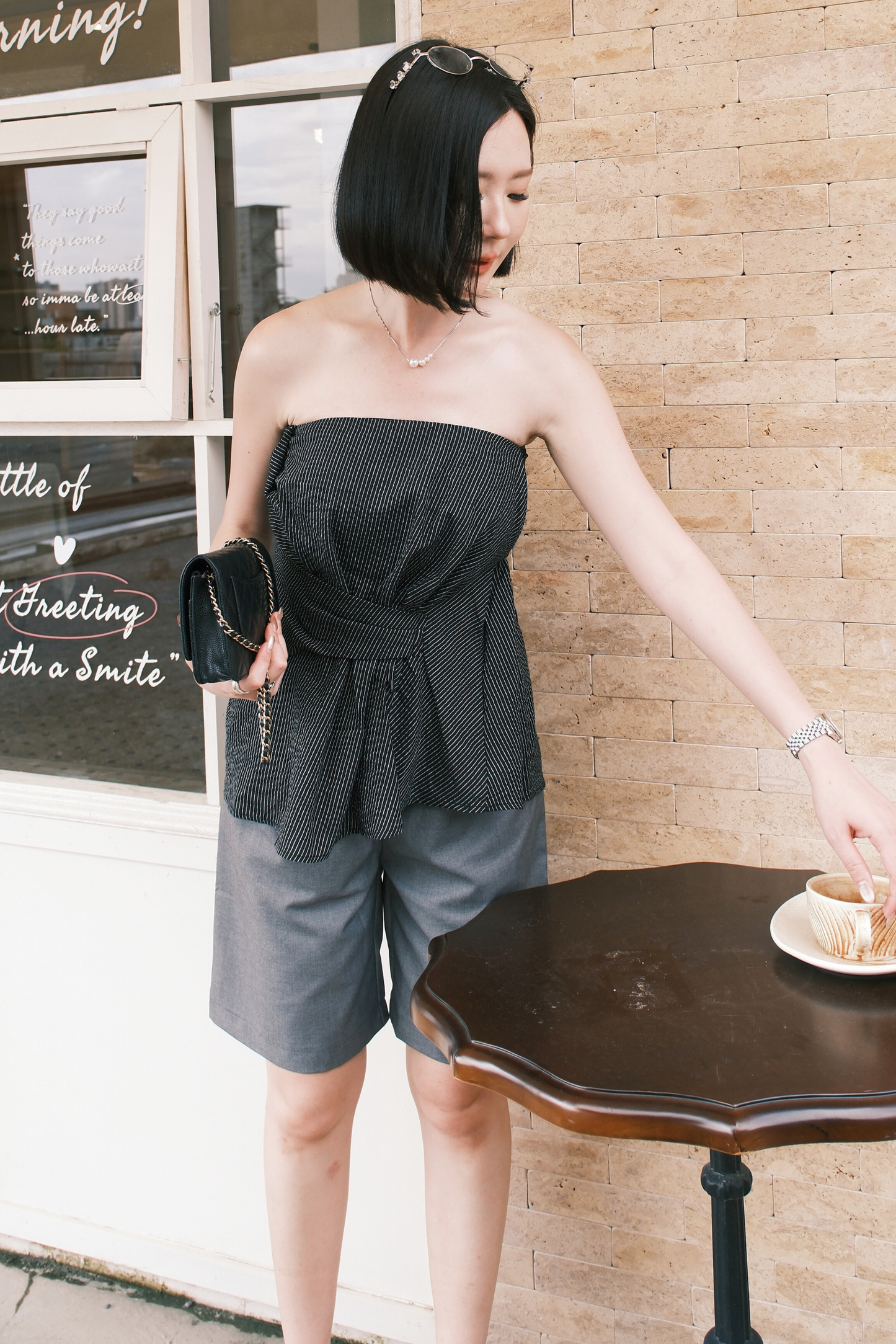 Éloise Strapless Pinstripe Peplum Top in Black
