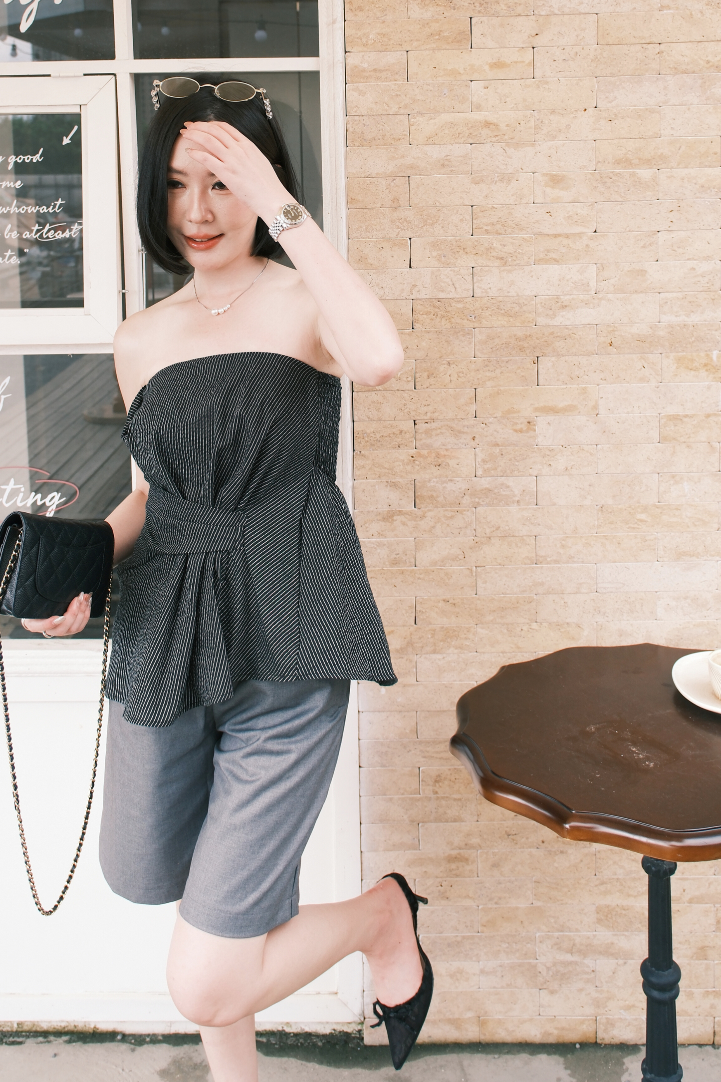 Éloise Strapless Pinstripe Peplum Top in Black
