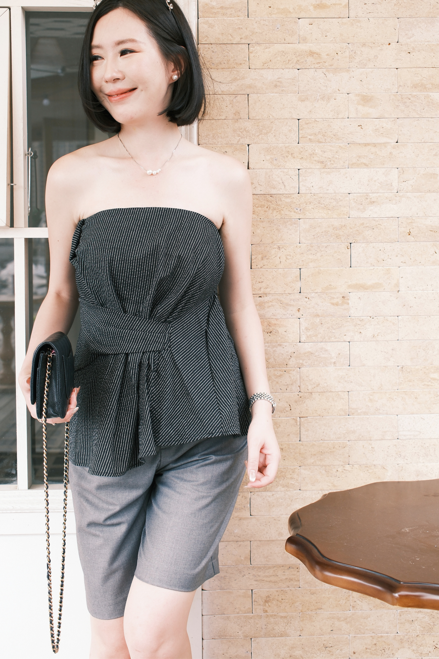 Éloise Strapless Pinstripe Peplum Top in Black